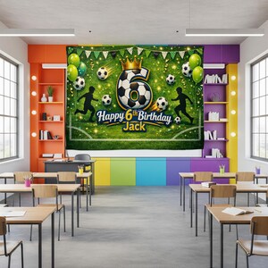 May include: A large green and white soccer-themed birthday banner with the text "Happy 6th Birthday Jack." The banner features soccer balls, silhouettes of soccer players, and a golden crown. Green balloons and a garland are also included.