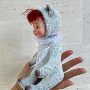 Handmade teddy bear. with baby face