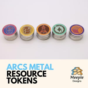 May include: Five metal game tokens with colorful designs. Each token has a silver base and a colored top with a unique graphic: a rose, barrels, a rocket, a diamond, and a stack of books. The text "ARCS METAL RESOURCE TOKENS" is below the tokens.