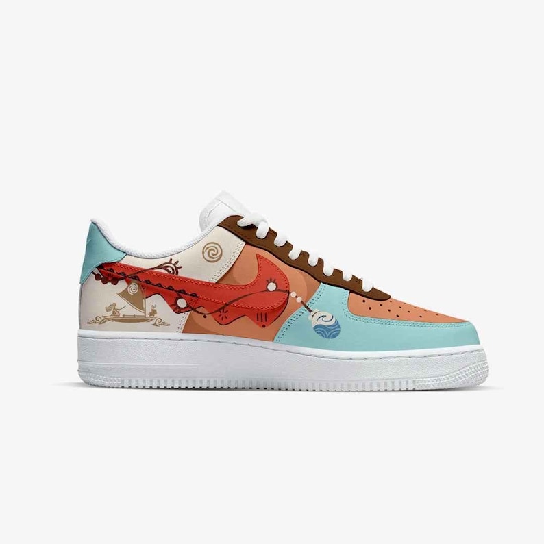 May include: Custom-designed Air Force 1 sneakers. The shoe features a white sole, with a tan, brown, and light blue upper. A red swoosh and detailed illustrations adorn the side. The laces are white and the tongue is brown.