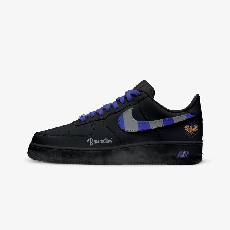 May include: Black athletic shoe with blue laces and a gray and blue swoosh. The shoe features the word "Ravenclaw" and a crest on the side. The sole has the word "AIR" printed on it.