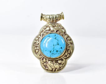 Tibetan Turquoise Colored Repoussé Pendant