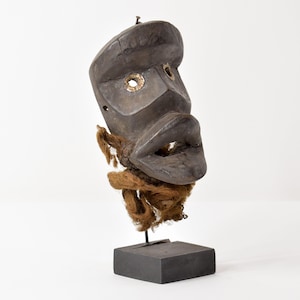 Dan Deangle Mask On Custom Stand Liberia