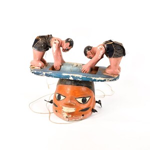 Yoruba Gelede Mask With Figures Carrying A Casket Nigeria