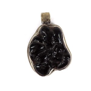 Black Tibetan Pendant with Silver Repoussé