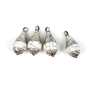 4 Tibetan Pendants White Crackle With Silver Repoussé
