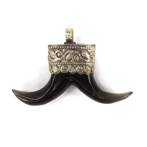 Black Tibetan Pendant With Silver Repoussé