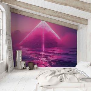 May include: A wall mural featuring a dark, mountainous island surrounded by water under a vibrant pink and purple sky. A bright, vertical beam of light extends from the peak of the mountain, casting a glowing reflection across the rippling water surface.