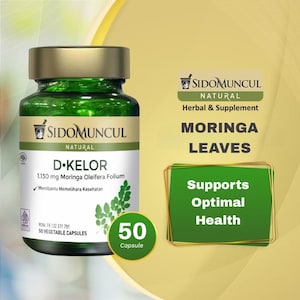 May include: A green glass bottle with a gold lid, labelled "D. Kelor" and "Moringa Leaves." The bottle contains 50 capsules and is a herbal supplement. The label states it supports optimal health.