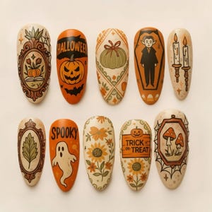 May include: A set of ten almond-shaped press-on nails featuring Halloween-themed illustrations including a pumpkin, a ghost, a vampire in a coffin, sunflowers, mushrooms, candles, and text reading HALLOWEEN, SPOOKY, and TRICK OR TREAT.