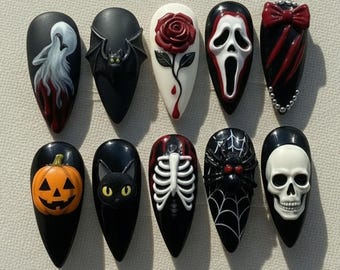 May include: A set of ten almond-shaped press-on nails featuring Halloween-themed designs including a howling wolf, a bat, a red rose, a ghost mask, a red bow, a jack-o'-lantern, a black cat, a rib cage, a spider on a web, and a human skull.