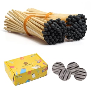 May include: Bundles of wooden matches with black tips, secured with an orange rubber band. A yellow box with the text "IGNITE EASE" and colorful illustrations is also present, along with several round match strike pads.