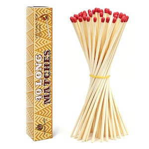 May include: A rectangular box with a tan and white geometric pattern containing 40 long matches, with the text 40 LONG MATCHES and KEEP AWAY FROM CHILDREN printed on the side. A bundle of long wooden matches with red tips is tied with a yellow band.