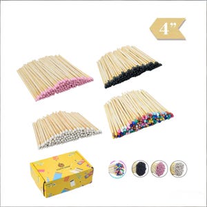 May include: A collection of wooden matches with various colored tips, including pink, black, white, and a mix of colors. The matches are approximately 4 inches long. A yellow box with the text "IGNITE EASE" is also visible.