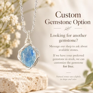 May include: A silver wire-wrapped necklace featuring a raw, light blue gemstone pendant on a silver chain. The text reads: Custom Gemstone Option, Looking for another gemstone? Message our shop to ask about available stones. If we have your preferred gemstone in stock, we can customize the gemstone for free. Natural stones vary slightly in shape and color.