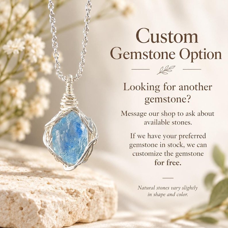 May include: A silver wire-wrapped necklace featuring a raw, light blue gemstone pendant on a silver chain. The text reads: Custom Gemstone Option, Looking for another gemstone? Message our shop to ask about available stones. If we have your preferred gemstone in stock, we can customize the gemstone for free. Natural stones vary slightly in shape and color.