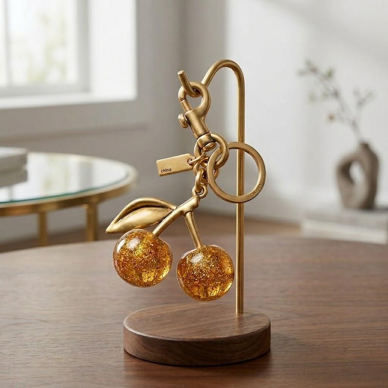 Coach Signature Cherry Bag Charm with Gold-Tone Finish Golden Gliters