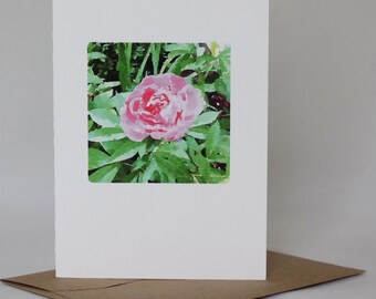 May include: A greeting card featuring a watercolor painting of a pink peony flower with green leaves.