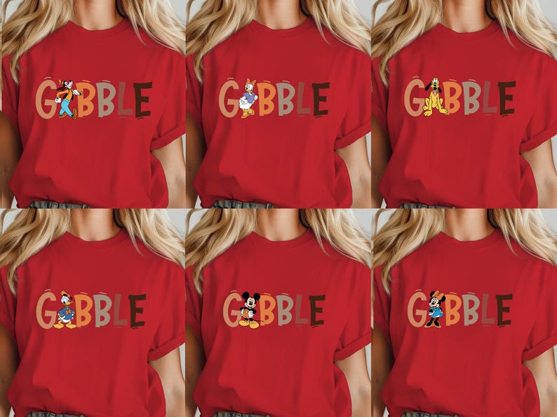 May include: Red t-shirts with the word "GOBBLE" in various colors and cartoon characters. The characters include Goofy, Donald Duck, Pluto, Daisy Duck, Mickey Mouse, and Minnie Mouse. The shirts are short-sleeved.