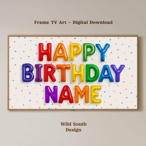 May include: A framed digital art print for a TV screen. The artwork features the words "HAPPY BIRTHDAY NAME" in colorful balloon letters against a white background with confetti. The text "Frame TV Art - Digital Download" and "Wild South Design" are also present.