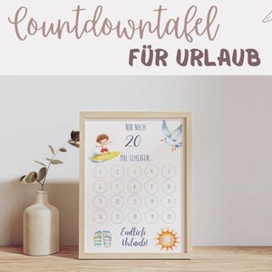 Könnte beinhalten: Gerahmter Druck mit dem Text "Countdowntafel FÜR URLAUB" oben. Der Druck zeigt einen Countdown-Kalender mit einem Surfer, einer Möwe und einer lächelnden Sonne. Der Text "Nur noch 20 mal schlafen..." ist ebenfalls sichtbar.