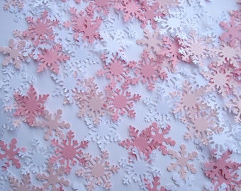 Pink snowflake confetti punches for Christmas party decorations, scrapbook embellishments