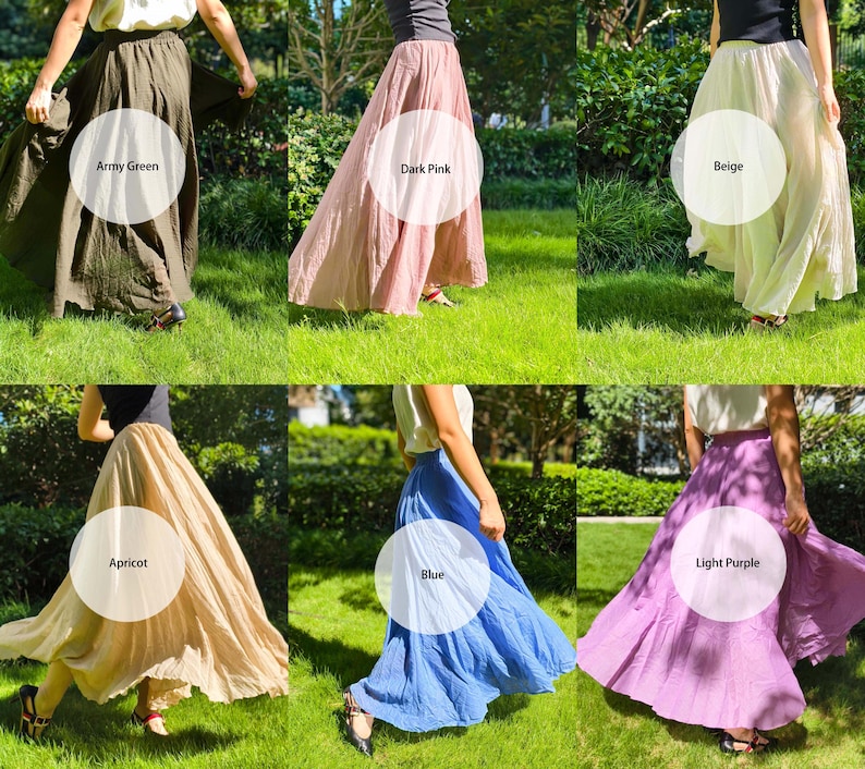 May include: A collection of six long, flowing skirts in various colours including army green, dark pink, beige, apricot, blue, and light purple. Each skirt features a gathered waistline and a full, flared silhouette that reaches the ankles.