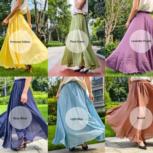 May include: A collection of six long, flowing skirts in primrose yellow, plum green, lavender purple, navy blue, light blue, and russet. Each skirt features a high-waisted design with a gathered, voluminous silhouette that reaches the ankles.