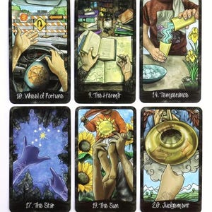 May include: Six tarot cards with intricate illustrations. The cards are labelled: "Wheel of Fortune," "The Hermit," "Temperance," "The Star," "The Sun," and "Judgement." Each card displays a unique design with vivid colours and symbolic imagery.
