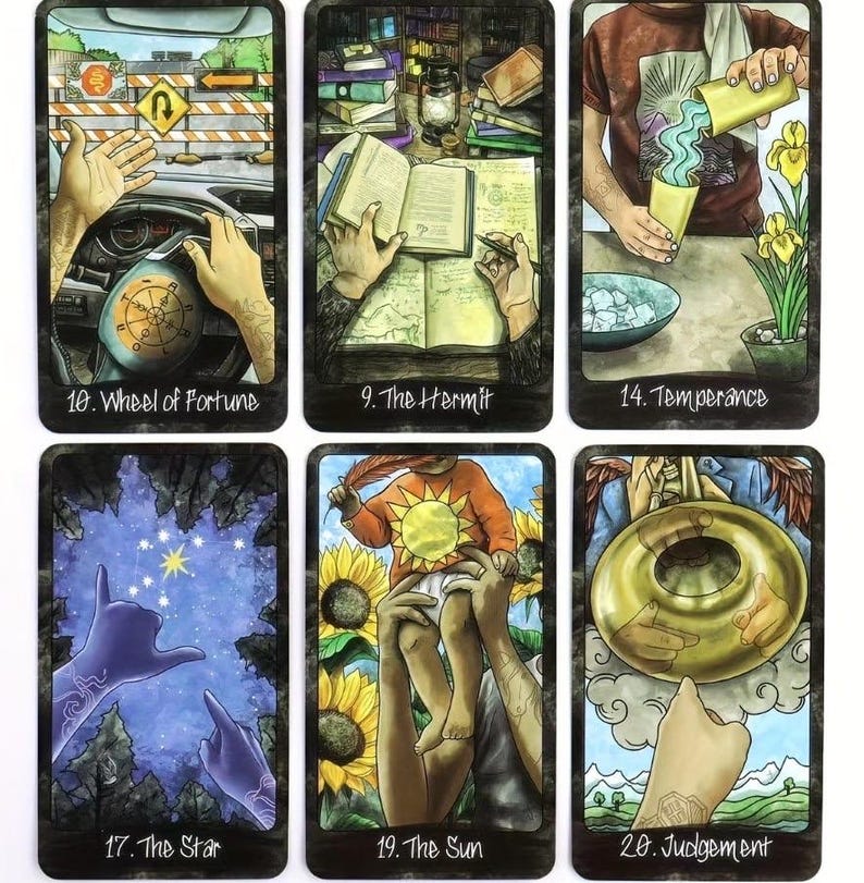 May include: Six tarot cards with intricate illustrations. The cards are labelled: "Wheel of Fortune," "The Hermit," "Temperance," "The Star," "The Sun," and "Judgement." Each card displays a unique design with vivid colours and symbolic imagery.