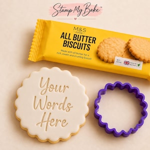 May include: A yellow M&S Food All Butter Biscuits packet, a white scalloped biscuit embossed with the text Your Words Here, and a purple scalloped plastic biscuit cutter. The packet features text including All Butter Biscuits and Stamp My Bake.