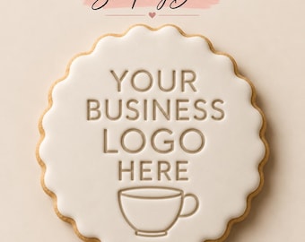 May include: A round, scalloped-edge cookie with smooth white icing. The center is embossed with the text "YOUR BUSINESS LOGO HERE" above a simple line-art icon of a coffee cup. The cookie has a light brown, baked edge visible around the perimeter.