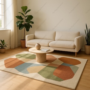 May include: A living room scene featuring a beige sofa, a round wooden coffee table, and a colorful geometric rug. The rug has shapes in shades of orange, green, and blue. Potted plants and a window with curtains complete the room.