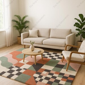 May include: A colorful geometric area rug with a mix of shapes and patterns, including squares, triangles, and wavy lines. The rug features a palette of muted colors like orange, green, pink, and black, creating a modern and inviting look for a living room.