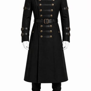 May include: Black military-style coat with a high collar and multiple rows of gold-colored buttons. The coat features leather straps on the sleeves and a belt with a square buckle. The long coat is displayed on a mannequin.