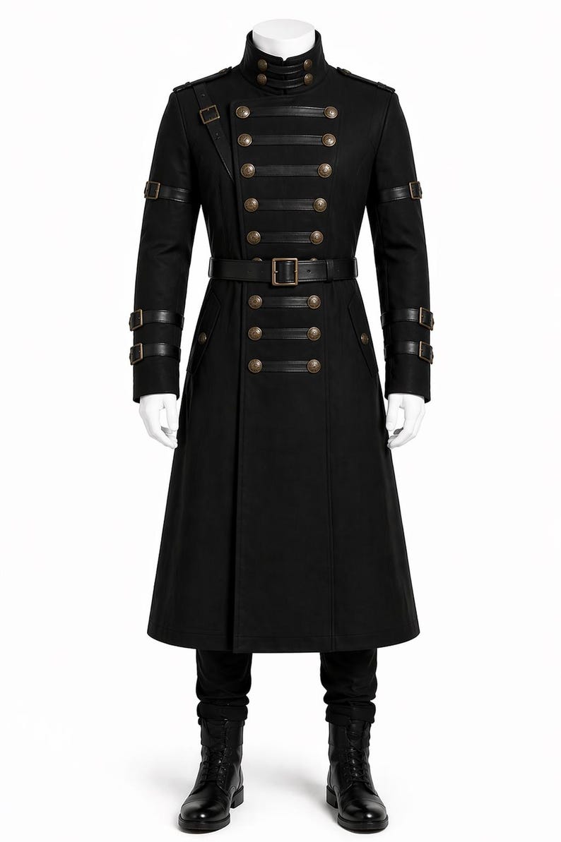 May include: Black military-style coat with a high collar and multiple rows of gold-colored buttons. The coat features leather straps on the sleeves and a belt with a square buckle. The long coat is displayed on a mannequin.