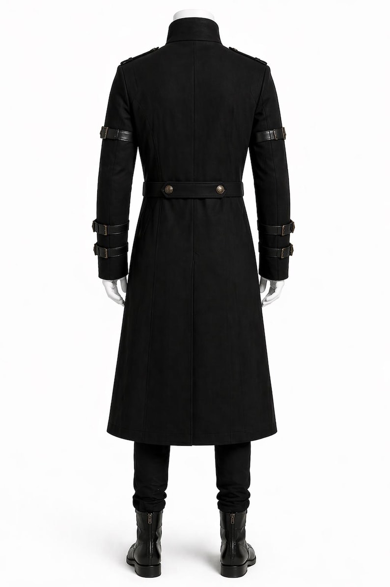 May include: A long black coat with a high collar, shoulder epaulettes, and decorative leather straps on the sleeves. The coat features a belted waist and is paired with black pants and boots. The overall style is reminiscent of a military or gothic aesthetic.