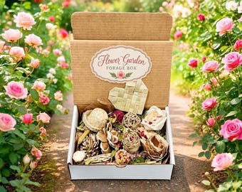 May include: A brown cardboard box with a white interior containing various dried botanical elements, including pinecones, wooden flowers, and woven spheres. A label on the lid reads Flower Garden FORAGE BOX with a small pink flower illustration.