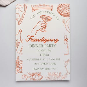 May include: A Friendsgiving dinner party invitation with a white background and orange illustrations of food and drink. The text reads "You are invited to Friendsgiving Dinner Party hosted by Olivia November 27 7:00 PM".