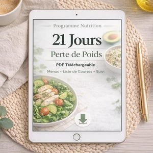 Peut inclure: Une tablette affiche un programme de perte de poids en français, intitulé "21 Jours Perte de Poids". L'image comprend une salade, un avocat et une tasse de café. Un stylo doré et un bol de graines sont également visibles.