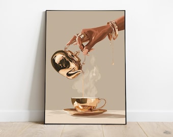 May include: A framed art print depicts a hand adorned with gold jewelry pouring liquid from a gold teapot into a matching teacup and saucer. Steam rises from the cup, suggesting a warm beverage. The background is a neutral beige.