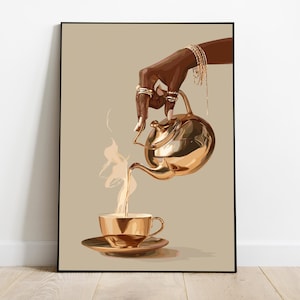 May include: Art print of a hand pouring tea from a gold teapot into a gold teacup. The hand is adorned with gold jewelry. The background is a solid tan color, and the print is in a black frame.