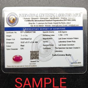 May include: A laboratory report of a red, oval-cut ruby, weighing 3.41 carats, with dimensions of 0.42 x 0.32 x 0.14 inches. The report is from the International Gem Testing Laboratory Jaipur, with the word "SAMPLE" in red.