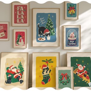 May include: A collection of ten framed Christmas-themed art prints featuring illustrations of Santa Claus, cats, a snowman, a wreath, and a snow globe. The prints display festive text including "FA LA LA LA", "Dear Santa", "Meow Meow Meow", and "Home for Christmas".