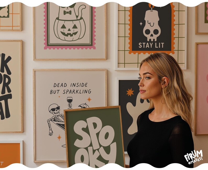 May include: A collection of framed wall art prints featuring Halloween-themed illustrations, including a cat in a pumpkin, a skull with the text STAY LIT, and a skeleton in a martini glass with the text DEAD INSIDE BUT SPARKLING, plus a SPOOKY print.