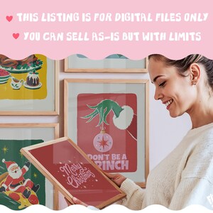 May include: A collection of framed Christmas-themed wall art prints featuring illustrations of a holiday feast, Santa Claus on a pizza slice, and a green hand holding a pink ornament with the text Don't Be A Grinch and Merry Christmas.