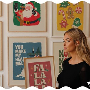 May include: A collection of framed Christmas-themed wall art prints featuring illustrations of Santa Claus, reindeer, gingerbread cookies, and holiday text including "You Make My Heart Melt" and "Fa La La La" in various colors.
