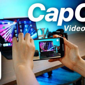 May include: A smartphone displaying a video recording interface with a tablet screen visible on the display. The text CapCut Video Editting is overlaid in white. A white square icon with a black stylized scissors logo is positioned in the corner.