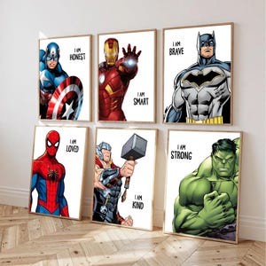 May include: Six framed superhero art prints. Captain America, Iron Man, Batman, Spider-Man, Thor, and the Hulk are depicted in vibrant colors. Each print includes the text "I AM" followed by a positive adjective, such as "Honest" or "Brave."