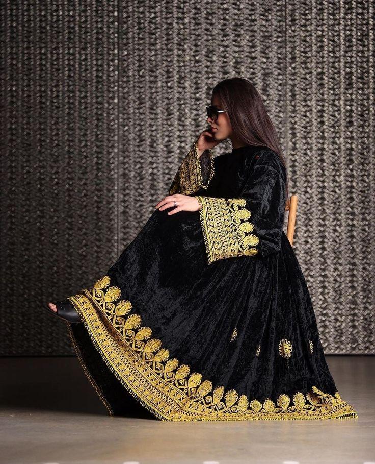 black dress with gold embroidery Black tulle dress adorned with intricate gold embroidery with a dramatic black silk taffeta overskirt